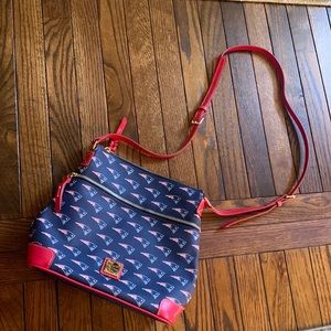 Never used Dooney & Bourke purse that is New England Patriots theme.